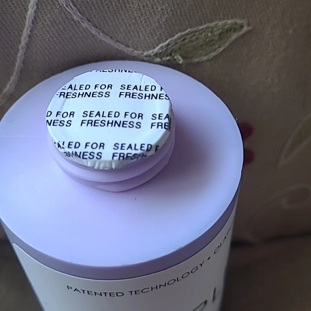 Olaplex No.4P Blonde Enhancer Toning Shampoo.